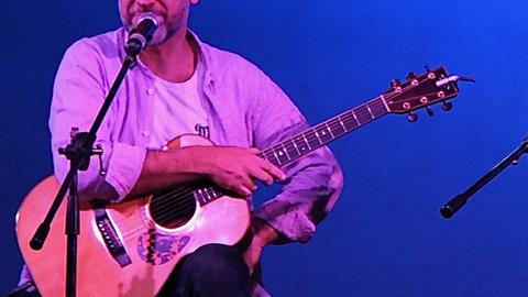 Casper Ace playing guitar
